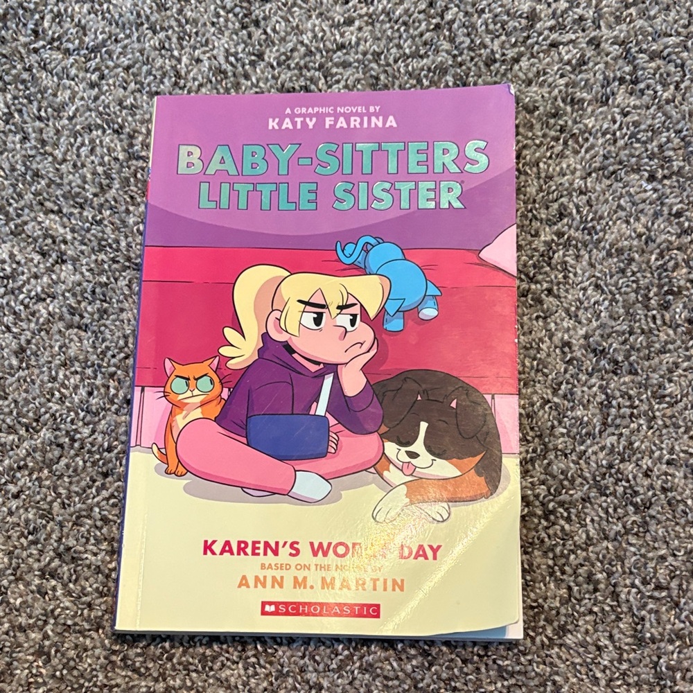 Scholastic Graphic Novel with Pink and Purple Cover